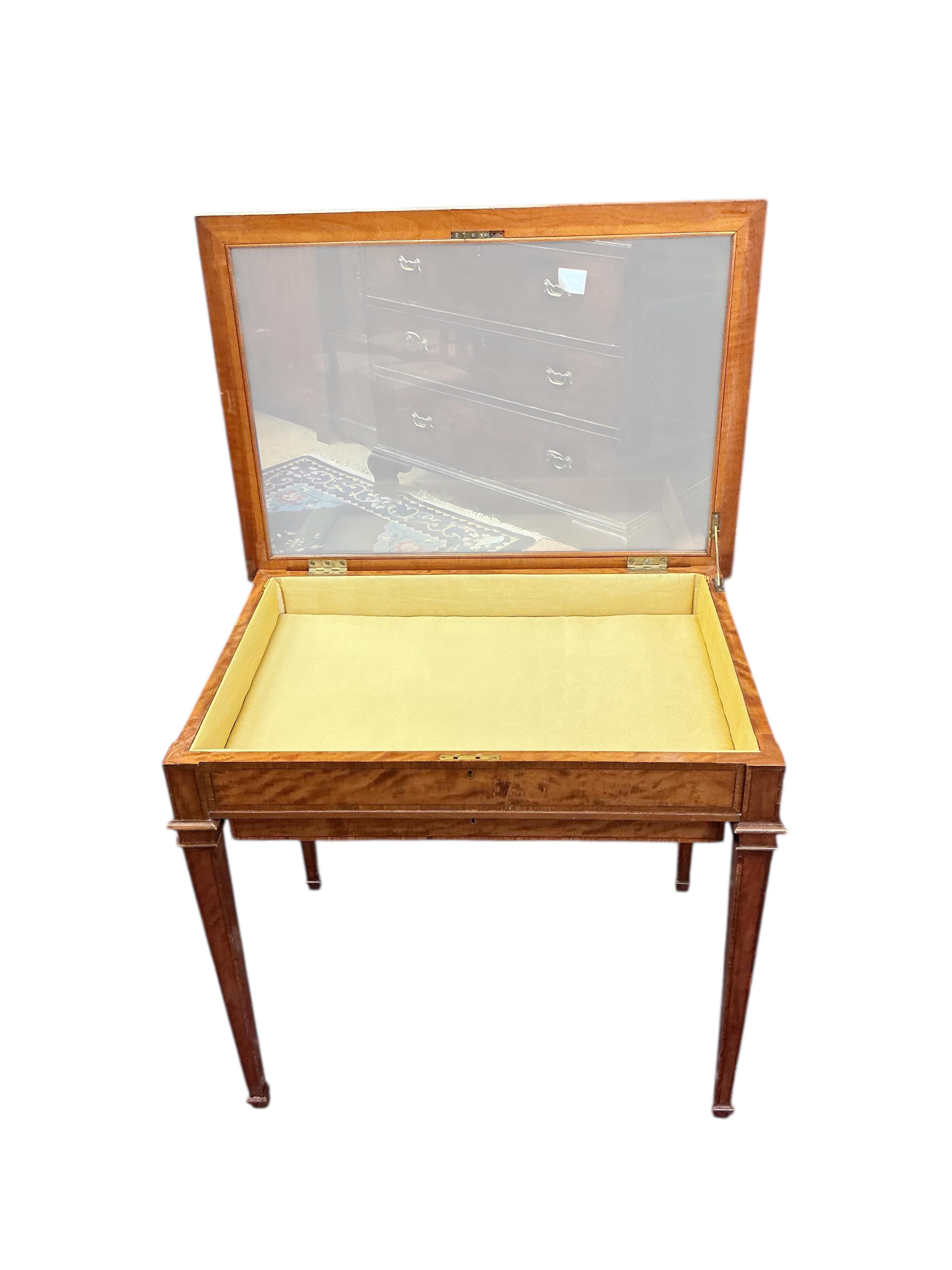 An Edwardian style rectangular satinwood bijouterie table, width 79cm, depth 56cm, height 70cm